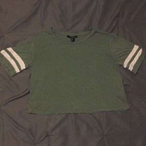 Green shirt with 2 white stripes on the side.